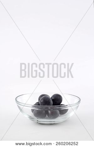 Fresh Black Grapes On White