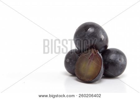 Fresh Black Grapes On White
