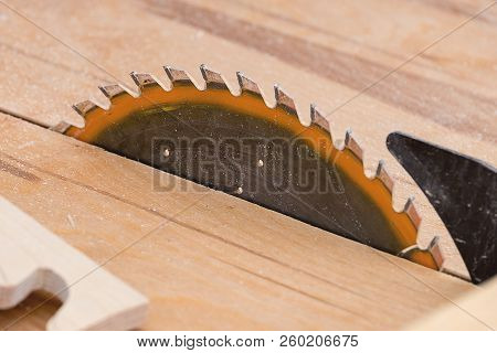Diagonal View Of Circular Saw Near The Saw Blade Part Of The Wood Workpiece, Carpentry