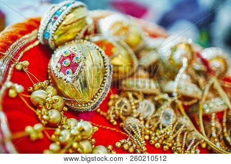 Selective Focus With Narrow Depth Of Field Of Coconut Decoration In Gold (shagun Nariyal), The Ritua
