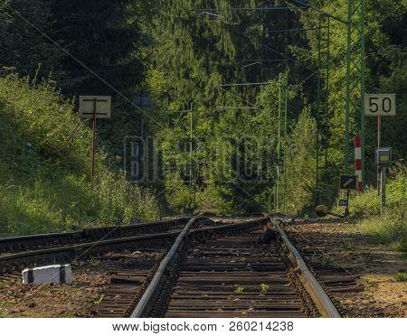 Railway Track In Rozmberk Nad Vltavou Station In Summer Day