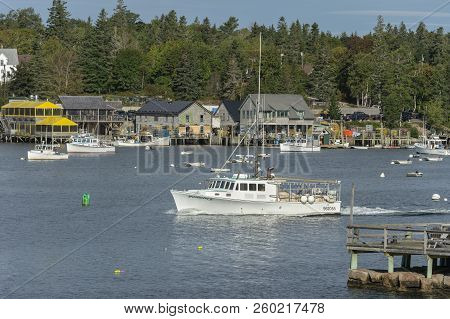 Bass Harbor, Maine, Usa - September 21, 2018: Lobster Boat Poseidon Leaving Bass Harbor With Village