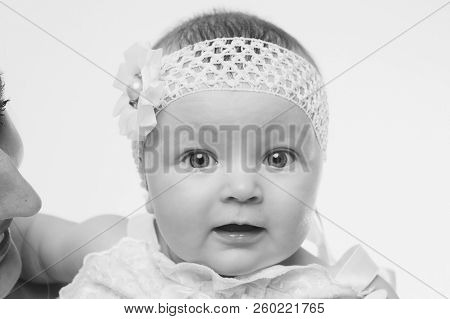 The Face Of A Schild With A Bandage On His Head Close-up
