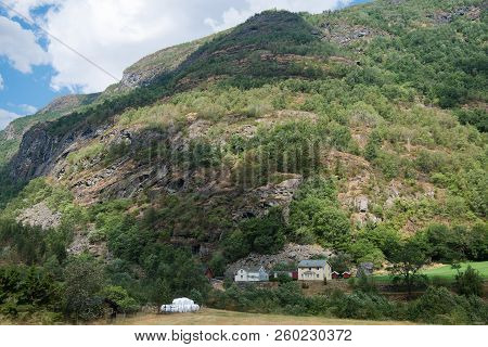 Scenic View Of Green Hill With Buildings, Hamar, Hedmark, Norway