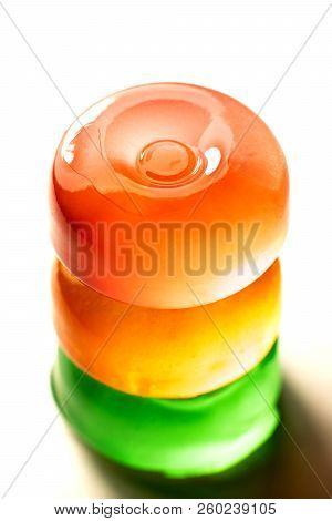 Three Clorfull Lollipops On A White Background