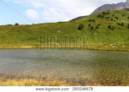 Natural Landscape Photo Of Small Mountain Lake Psenodah In North Caucasus Near Fisht And Oshten Moun