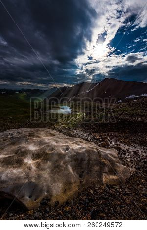 Sun Shines On A Chunk Of Snow Colorado Mountains