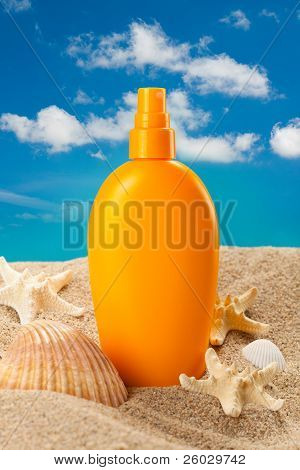 Suntan Oil On Blue Sky Background