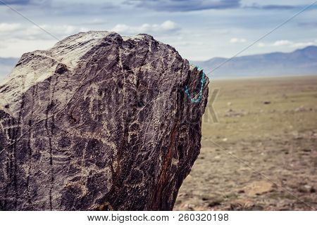 Tarkhatinsky Megalithic Complex Fragment. Ancient Petroglyphs. Altai, Russia