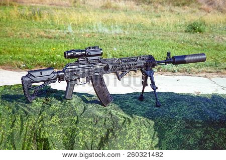 The Upgraded Kalashnikov Ak47 Assault Rifle On Bipods With Tactical Accessories, An Optical Sight An