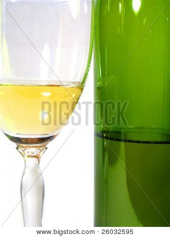 Wineglass of wine and bottle