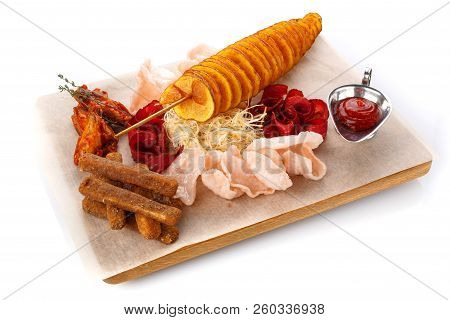 Set Snacks To Beer. Potato Chips, Chicken Wings, Basturma, Cheese And Chicken Wings On A Wooden Boar