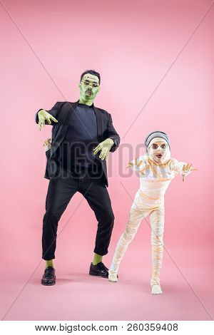 Halloween Family. Happy Father And Children Girl In Halloween Costume And Makeup. Bloody Theme: The 
