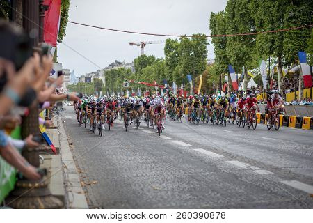 Paris, France - July 23, 2017: Group Of Cyclists On Avenue Des Champs-elysees For The Final Stage Of