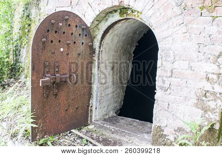 Old Metal Door To The Basement. Metal Door To The Cellar.