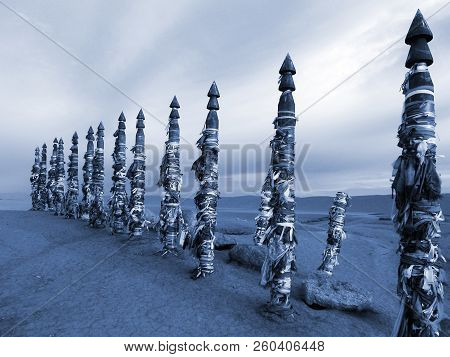 Vivid Colored Ribbons Hadak Tied On Posts Of Wish. Wooden Ritual Pillars. Sacred Place Of Buddhist S
