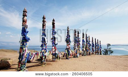 Vivid Colored Ribbons Hadak Tied On Posts Of Wish. Wooden Ritual Pillars. Sacred Place Of Buddhist S