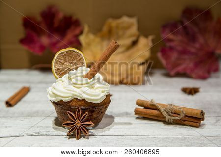 Pumpkin Spice Muffin Frosted With Mascarpone Chesee And Cream, Whipped 
Icing, Decorated With Cinnam