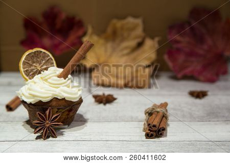 Pumpkin Spice Muffin Frosted With Mascarpone Chesee And Cream, Whipped 
Icing, Decorated With Cinnam