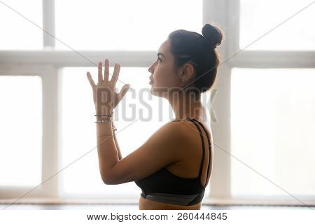 Young Attractive Woman Practicing Yoga, Doing Meditation Exercis