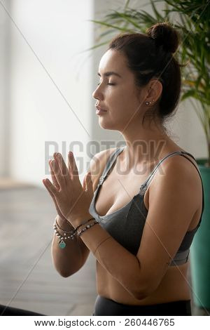 Portrait Of Young Attractive Woman Practicing Yoga, Namaste Gest