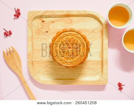 Mooncake On A Wooden Plate For Mid-autumn Festival Or Mooncake Festival. Top View.