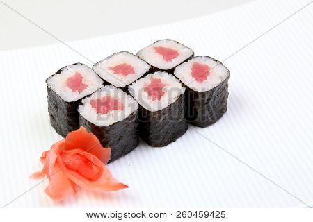 Rolls Of Syak Maki. Japanese Food On A Beautiful Dish. Dietary Food. An Exquisite Japanese Dish. Fre