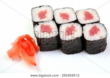 Rolls Of Syak Maki. Japanese Food On A Beautiful Dish. Dietary Food. An Exquisite Japanese Dish. Fre