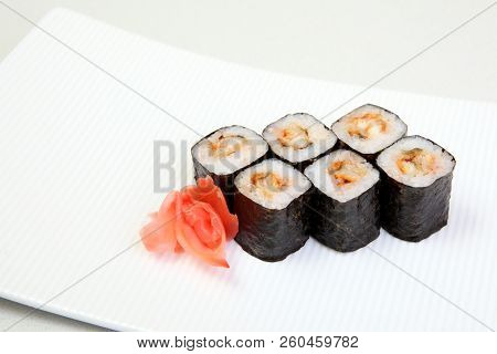Rolls Of Syak Maki. Japanese Food On A Beautiful Dish. Dietary Food. An Exquisite Japanese Dish. Fre