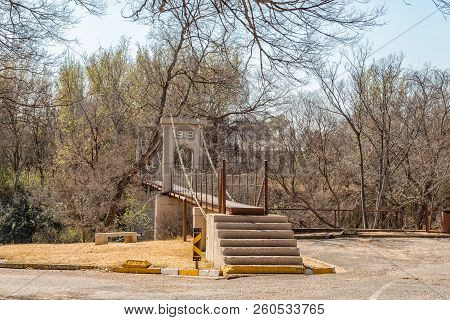 The Historic Suspension Bridge Over Part Of The Vaal River, Built In 1919, In Parys In The Free Stat