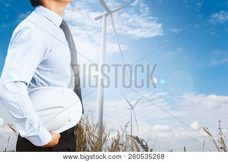 Engineer Man Are Investigating The Wind Turbine.