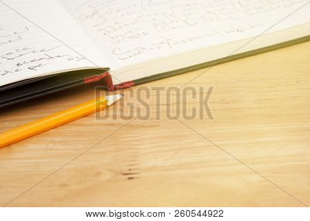 Pencil Oand Opened Notebok White Paper Sheet Over Wooden Table. Copy Space.
