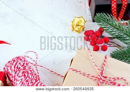 Christmas Decorative Background With Fir Branches, Cones, Redr And Black Christmas  Gifts, Ball On T