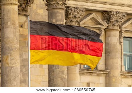 Federal Republic Of Germany, German National Flag Waving In Front Of The Parliament Building Columns
