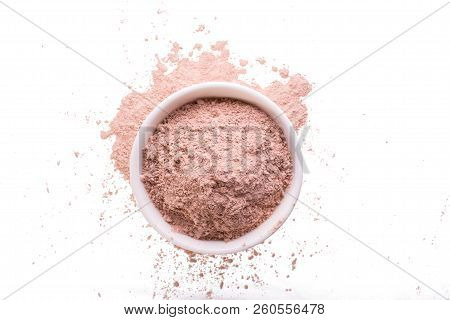 Dry Pink Clay Powder Mask For Face And Body  In Ceramic Bowl Isolated On White