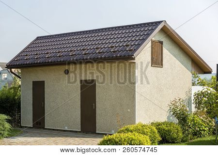 New Detached Small Barn, Workshop Or Utility Building With Brown Shingle Roof, Two Doors And Attic O