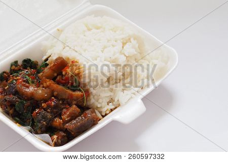 Stir-fried Crispy Pork With Chilies And Holy Basil Leaf On Rice In Foam Box For Take Home
