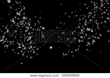 Split Debris Of Stone Exploding Against Black Background.
