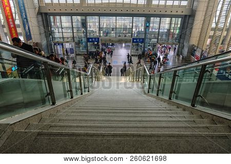Yiwu/china - January 24 2015: Chinese People Wait For The Rocket Train To Go To Another City In Yiwu