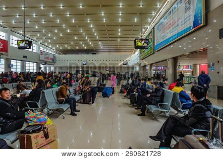 Yiwu/china - January 24 2015: Chinese People Wait For The Rocket Train To Go To Another City In Yiwu