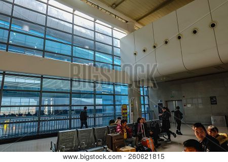 Yiwu/china - January 24 2015: Chinese People Wait For The Rocket Train To Go To Another City In Yiwu