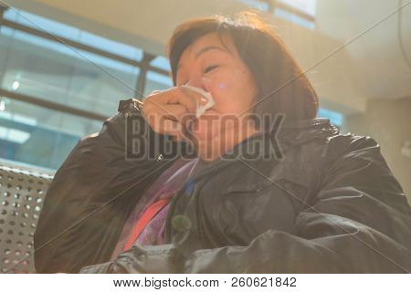 Old Asian Women Traveler Boring And Waiting For Transit To Shang Hai In Yiwu High Speed Train Termin