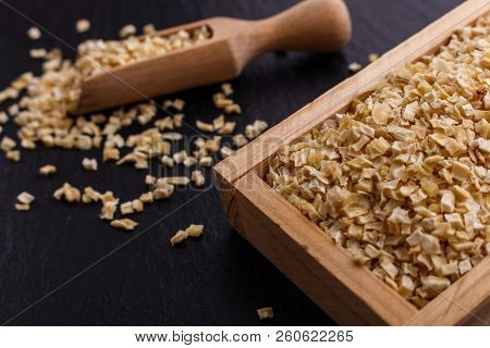 Fragrant Dried Parsnip On A Dark Stone Background