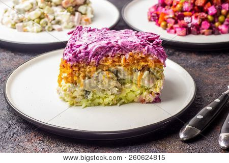 Assortment Salad Of Russian Cuisine - Olivier Salad, Vinaigrette - Beet Salad, Herring Salad.