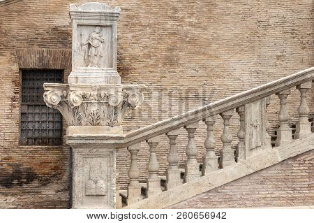 Ancient Staircase Of A Roman Church. Detail Of The Bas-relief On The  Chapiter