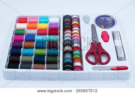 The Sewing Boxset.there Are Colorful Thread,scissor,measuring Tape And Needle,on White Background