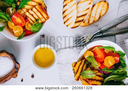 Cherry Tomato Salad With Grilled Haloumi Cheese, With Chard And Arugula