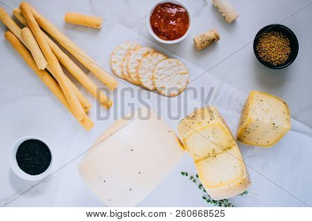 Assorted сachotta Cheese With Black Cumin, Fenugreek And Herbs With Jam, Baguette, Bread Sticks And 
