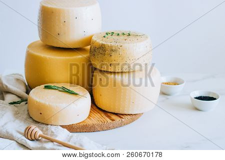 Assorted Cachotta Cheese Head With Black Cumin, Fenugreek And Herbs On White Background