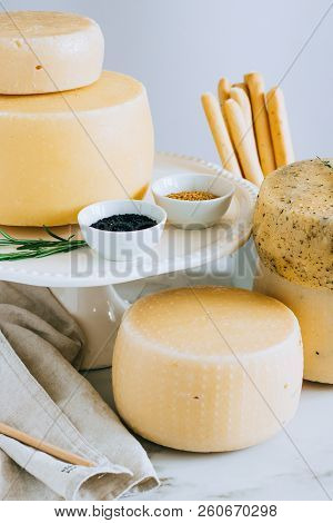 Assorted Cachotta Cheese Head With Black Cumin, Fenugreek And Herbs In Cake Stand With Bread Sticks 